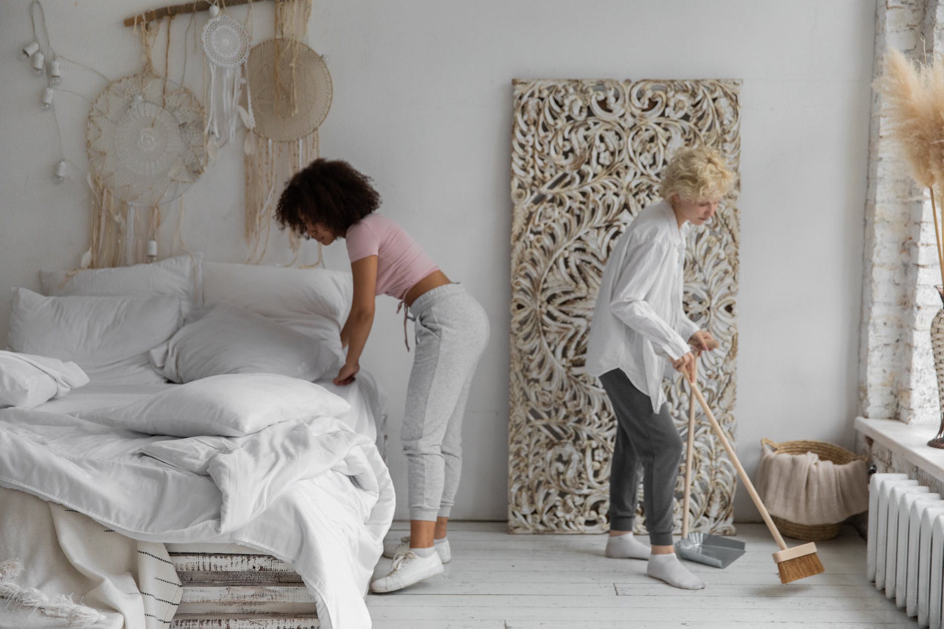 women cleaning the bedroom