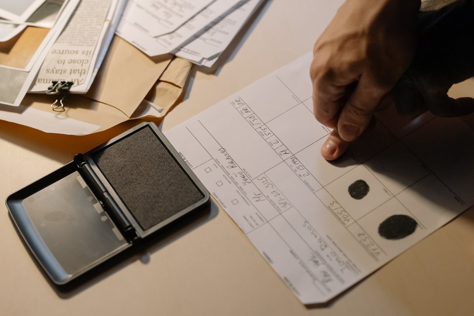 close up photo of putting of fingerprint on paper