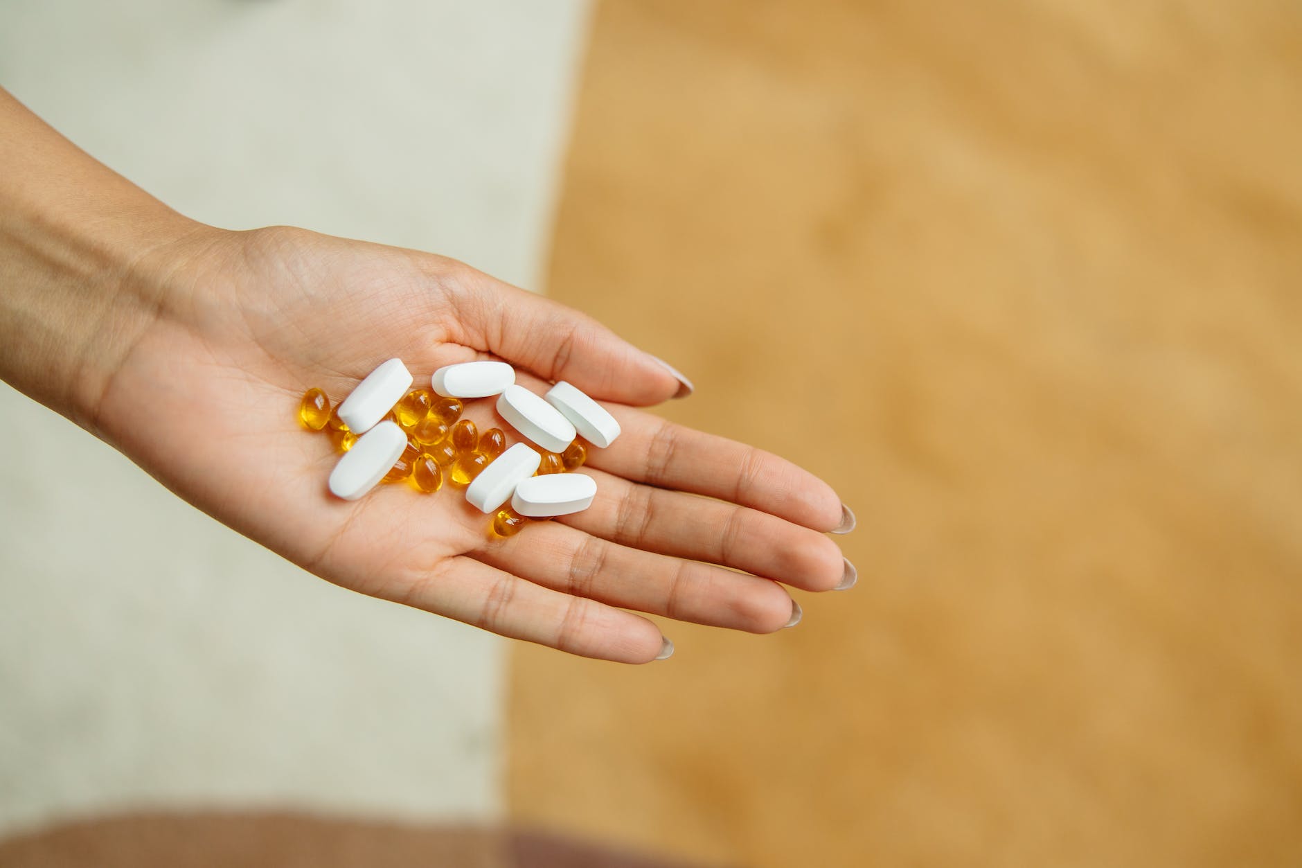 pills on a person s hand