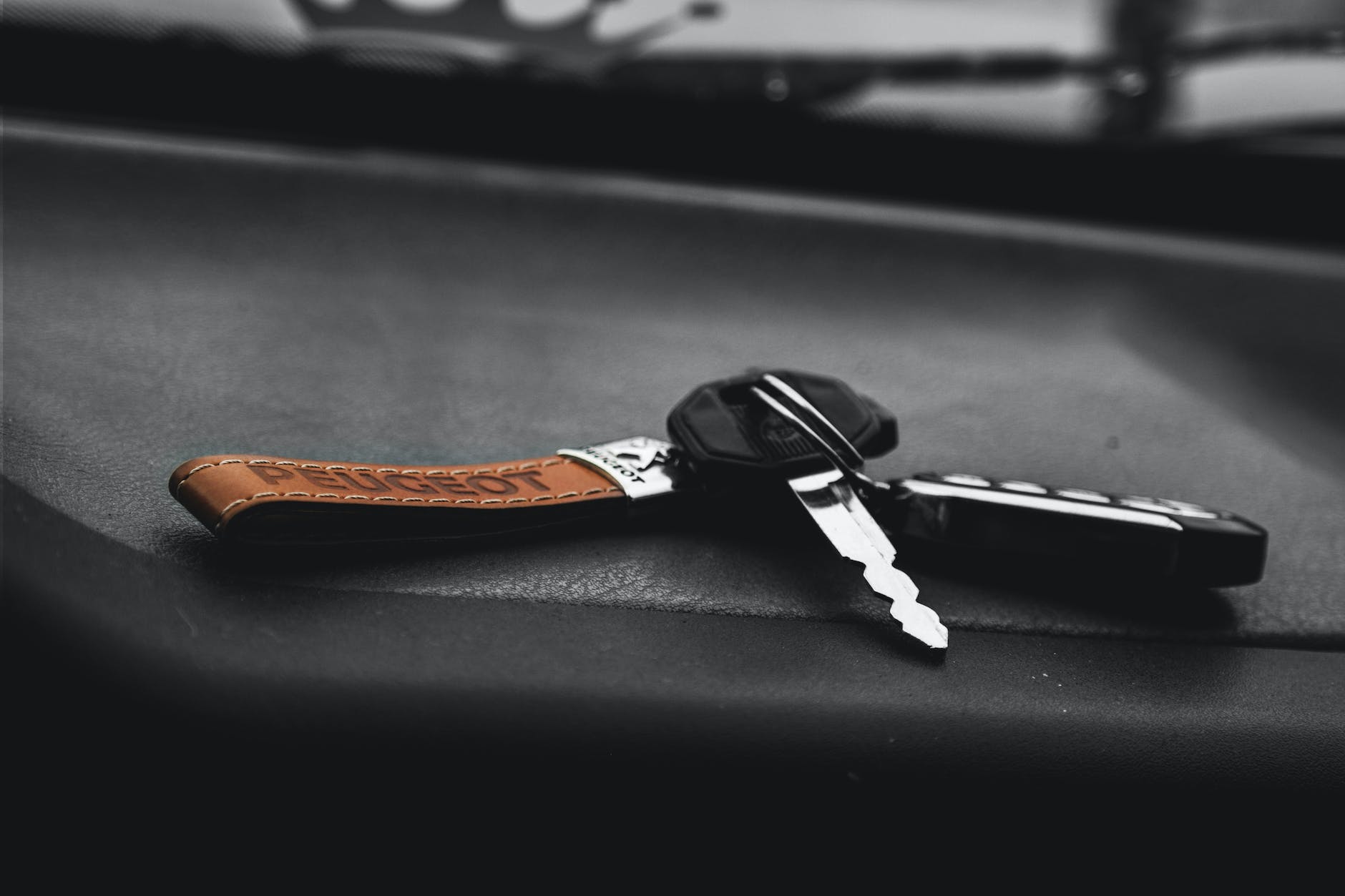 car keys on black surface