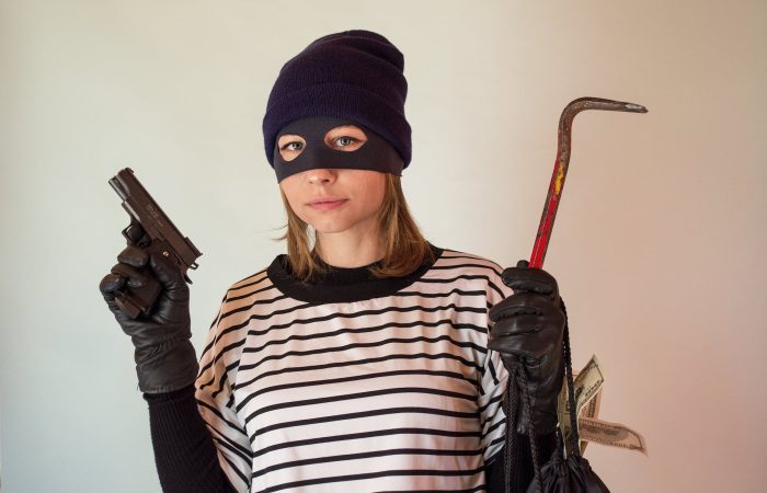 a woman wearing a robber mask