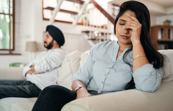 upset young indian couple after conflict