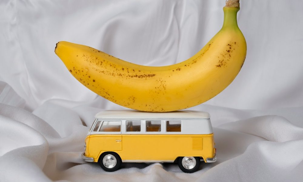 yellow banana fruit on white textile