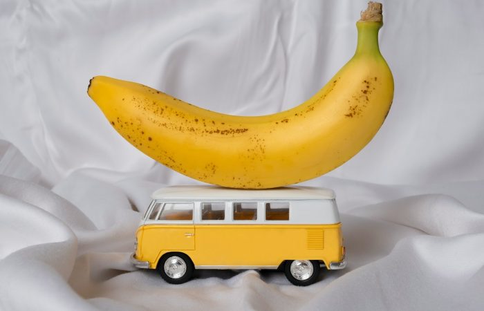 yellow banana fruit on white textile