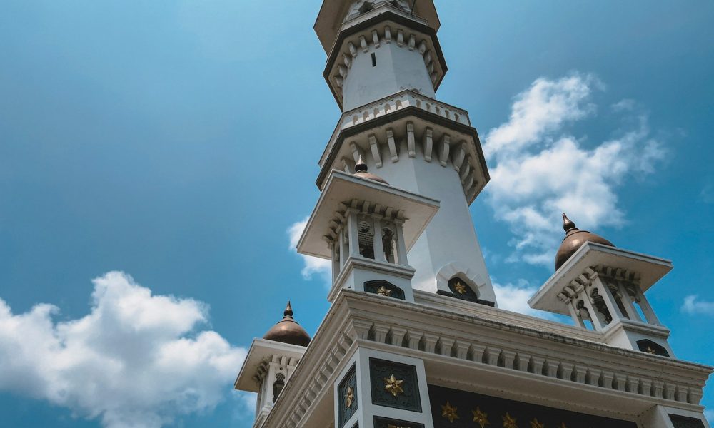 low-angle photography of white and brown tower