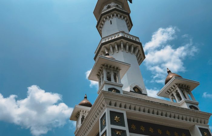 low-angle photography of white and brown tower